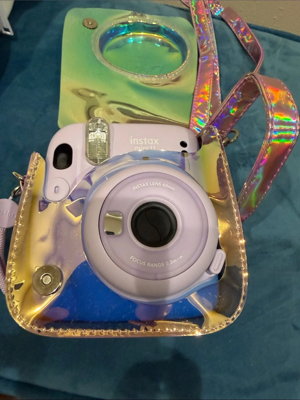 Fujifilm instax mini 11 camera with stylish metallic cross body bag.